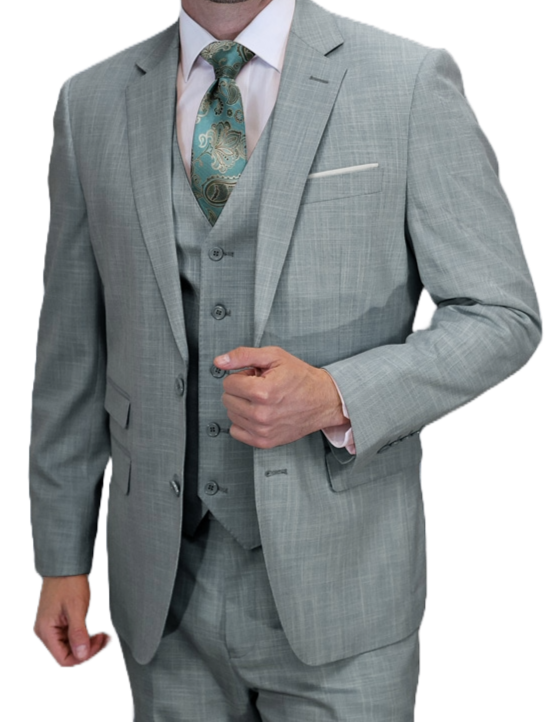 Man wearing a light gray suit with a patterned tie on a white background