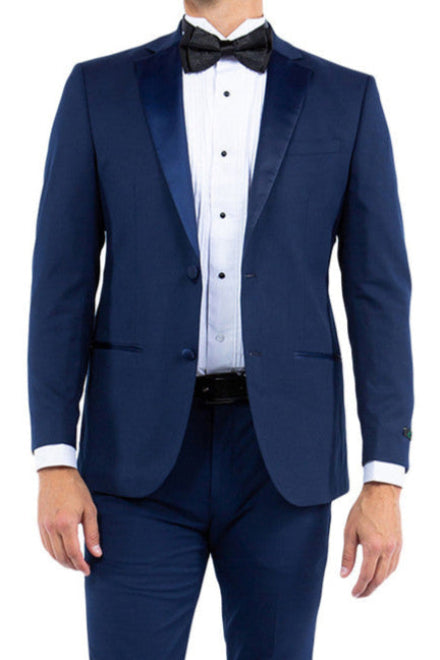 Man wearing a navy blue tuxedo with a bow tie on a white background