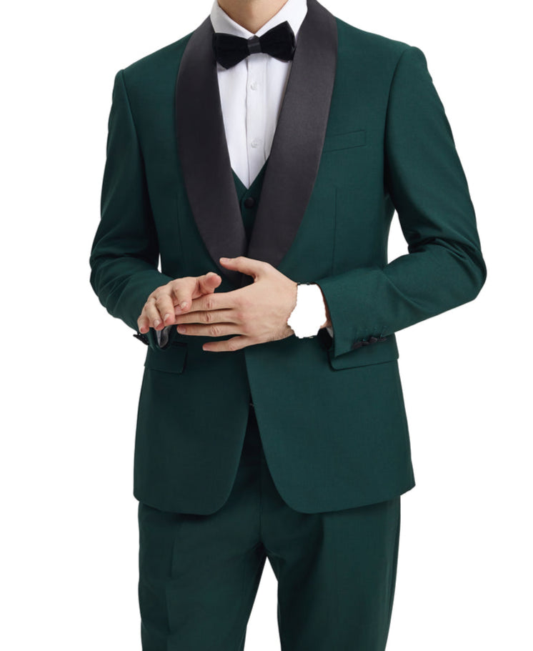 Man wearing a green tuxedo with black lapels on a white background